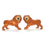 A pair of late 19th century Staffordshire pottery lions, of traditional Victorian design,