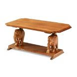 A coffee table with elephant supports and low shelf. Width 91 cm, depth 43.5 cm, height 39 cm.