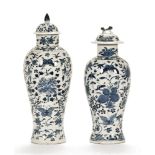 Two Chinese blue and white lidded baluster vases, of Kangxi style,