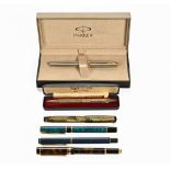 A stainless steel and gold plated Parker ink pen, a silver "Yard of Lead" and four other pens.