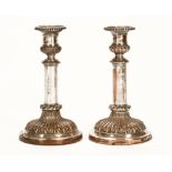 A pair of silver plated on copper telescopic candlesticks. Height adjustable from 23 cm to 28 cm.