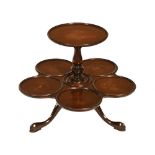 A table top two tier revolving lazy susan, mahogany. Height 40 cm, width +/- 48 cm.