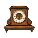 A late 19th century walnut cased mantel clock,