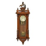 A late 19th century Viennese walnut wall clock, with eight day movement,