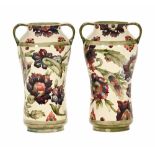 A pair of Moorcroft pottery two handled baluster vases,