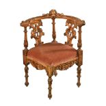 A Victorian carved wooden carver armchair, with drop in seat and raised on turned legs.