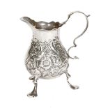 A George II silver cream jug, London 1753, maker probably Richard Gosling, 86 grams, height 9.8 cm.