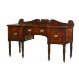 A Regency mahogany inverted breakfront sideboard with rear upstand,