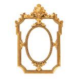 A late 20th century rectangular gilt framed mirror, with oval central panel.