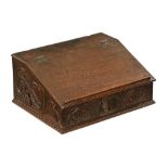 A late 17th century oak bible box, with slope front to fitted interior,