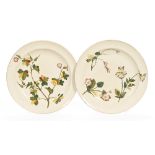 A pair of Wedgwood hand painted foliate patterned plates, with impressed marks. Diameter 25.5 cm.