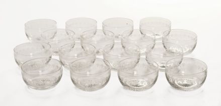 A set of sixteen etched glass dessert bowls.