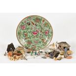 A collection of miniature Chinese garden ornaments, and a Famille Rose dish. Diameter 23 cm.