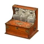 A late Victorian oak cased tantalus and games box,