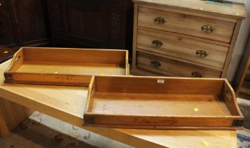 Two brass bound wooden trays or book troughs, 73 cm long,
