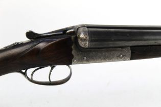 A Belgian 12 bore side by side shotgun, with 28" barrels, cylinder and quarter choke,