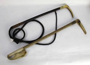 A Swaine hunting crop with red stag antler handle, metal collar, wrapped shaft and thong section,