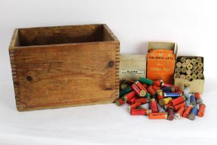 A vintage Eley wooden shotgun ammunition crate, containing various collectors cartridges,