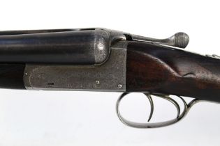 An Alex Martin 12 bore side by side shotgun, with 25" barrels, half and three quarter choke,