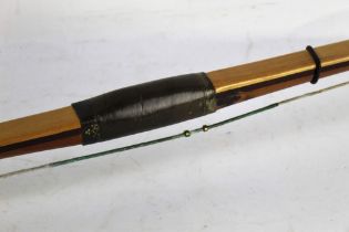 Archery equipment - Alan Beatty an archery longbow with horn nocks and leather grip.