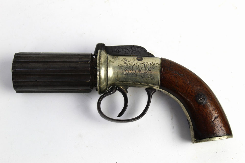 A pepperbox percussion pistol, having six barrels, barrel length 2 3/4", overall length 20 cm (AF).