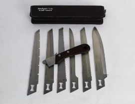 A Kershaw Kai Blade Trader knife with six different blades +/- 7" each.