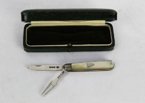 A silver and mother of pearl hallmarked folding fork and knife,