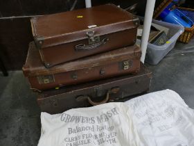 Three small vintage suitcases