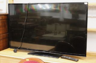 50" Hitachi flat screen television with remote control