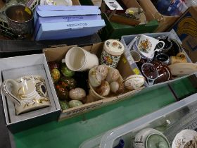 Three boxes of oriental tea bowls, treacle glazed pottery, decorative eggs,
