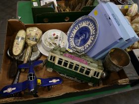 Box of Wedgwood commemorative plates, model tram and plane,