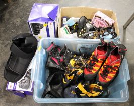 Two boxes of climbing equipment including shoes, grippers, chalk balls,