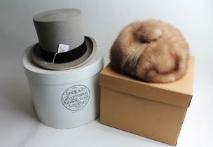 Grey top hat in James Locke & Co Limited hat box and a Mitzi Lorenz fur hat with box