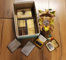 Wooden cuckoo clock, metal card cases, Ronson lighters,