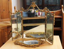 Frameless bevelled edge folding dressing table mirror with gilt metal decoration and small shaped