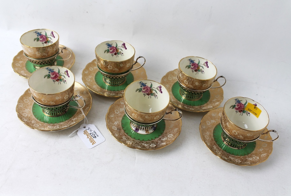 1930's Grosvenor china floral cups and saucers having Birmingham silver cup holders