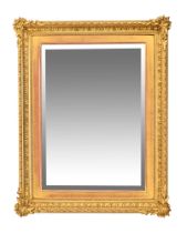 A late 19th century gilt wood and gesso frame with bevelled glass mirror.