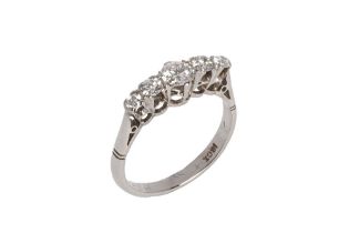 An antique 18 ct white gold and five stone diamond ring. Size L, overall weight 2.8 grams.