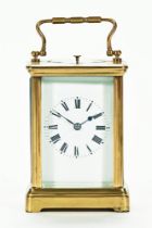 An early 20th century brass carriage clock with leather case, 13 cm high (see illustration).