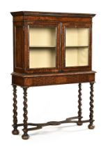 An early 18th century William and Mary walnut cabinet on stand,