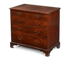 An early 19th century mahogany chest, of two short and three long drawers on bracket feet.