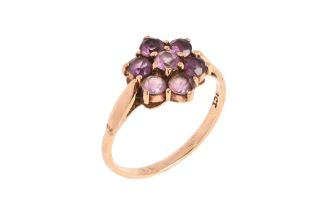 A 9 ct gold cluster dress ring with amethyst coloured stone, size R/S, 2.3 grams.