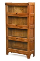 An early 20th century oak bookcase, with glazed up and over four sections.