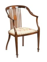 An Edwardian mahogany salon armchair, with inlay and burr decoration with slat back, sweep arms,