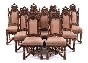 A set of nine late Victorian golden oak dining chairs, in theatrical Carolean style,