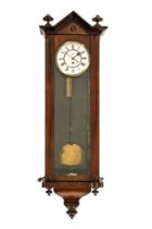 A 19th century Vienna style regulator wall clock, mahogany cased and with single weight.