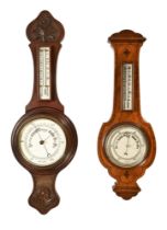 An Edwardian walnut aneroid barometer, together with an Edwardian carved banjo barometer.