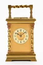 A late 19th century brass carriage clock of French design,