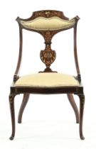 A late Victorian/Edwardian mahogany salon armchair,
