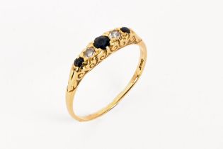 A 18 ct gold sapphire and diamond ring. Size R. Gross weight 2.2 grams.